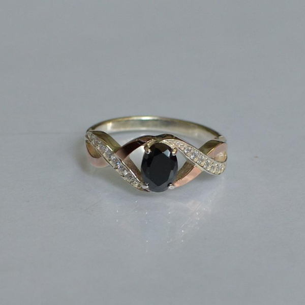 Срібна каблучка з золотими вставками