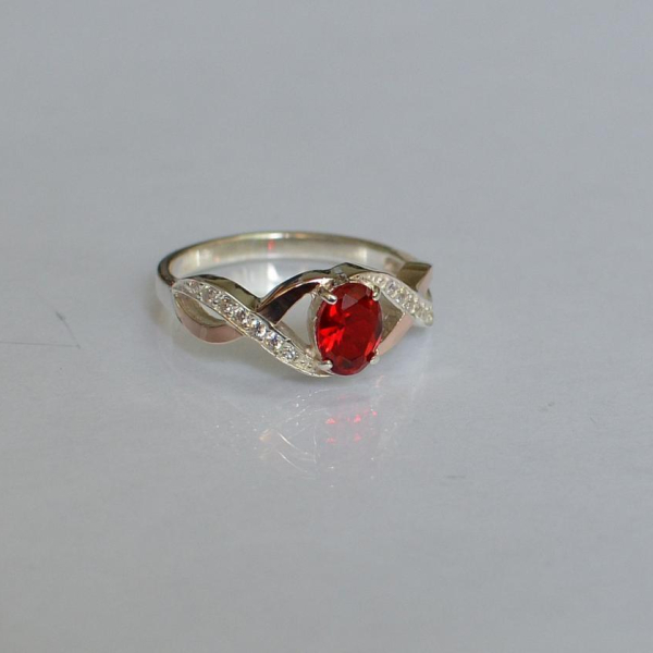 Срібна каблучка з золотими вставками