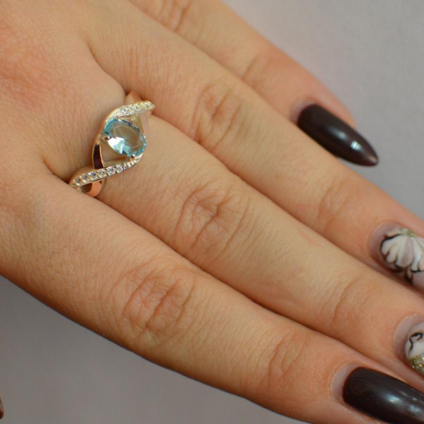 Срібна каблучка з золотими вставками