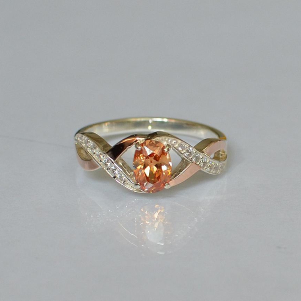 Срібна каблучка з золотими вставками