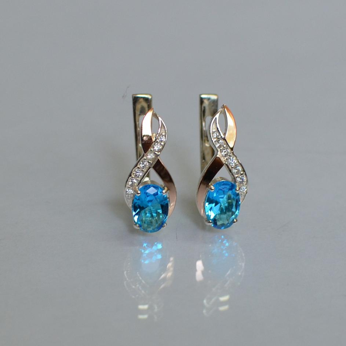 Срібні сережки з золотими вставками