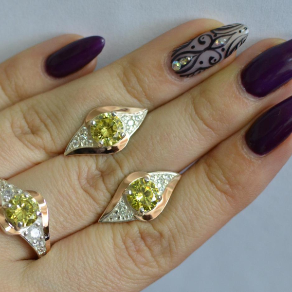 Срібний набір з золотими пластинами