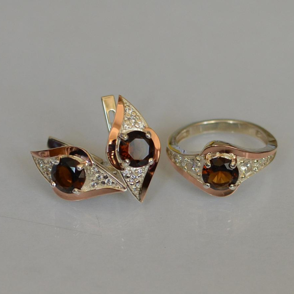 Срібний набір з золотими пластинами