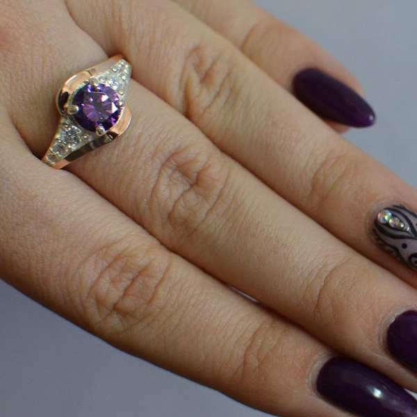 Срібна каблучка з золотими вставками