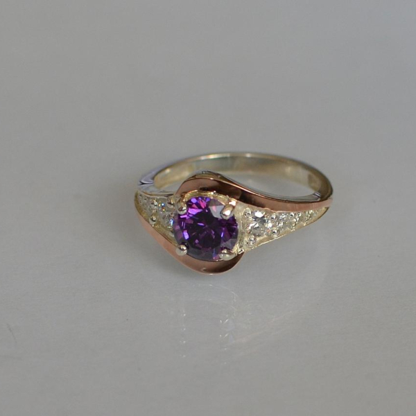 Срібна каблучка з золотими вставками