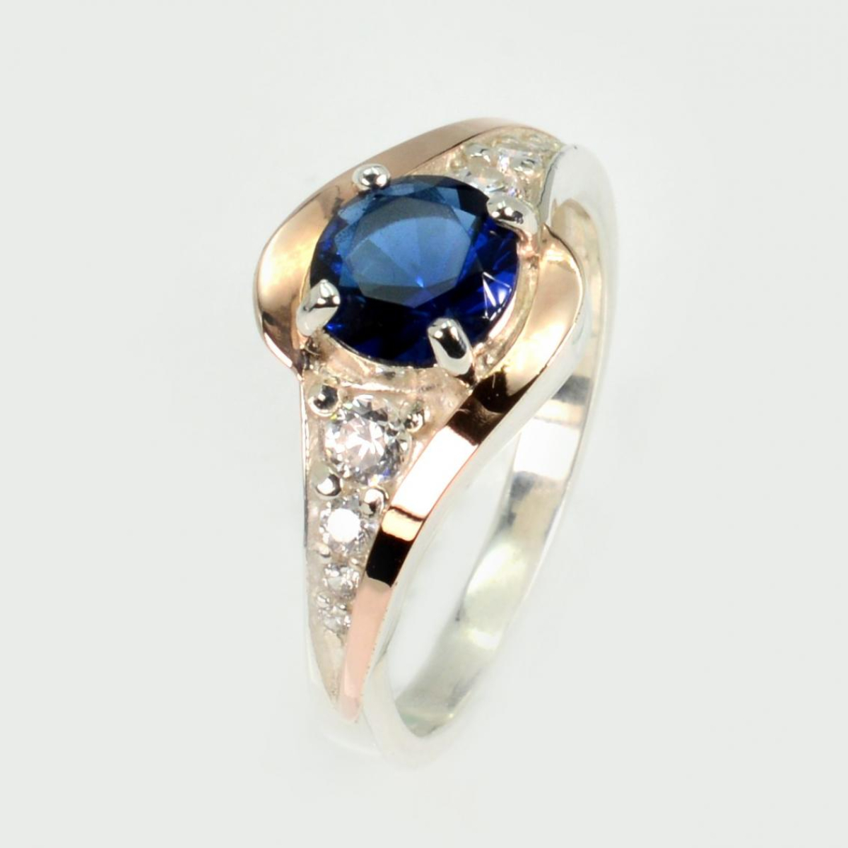 Срібна каблучка з золотими вставками