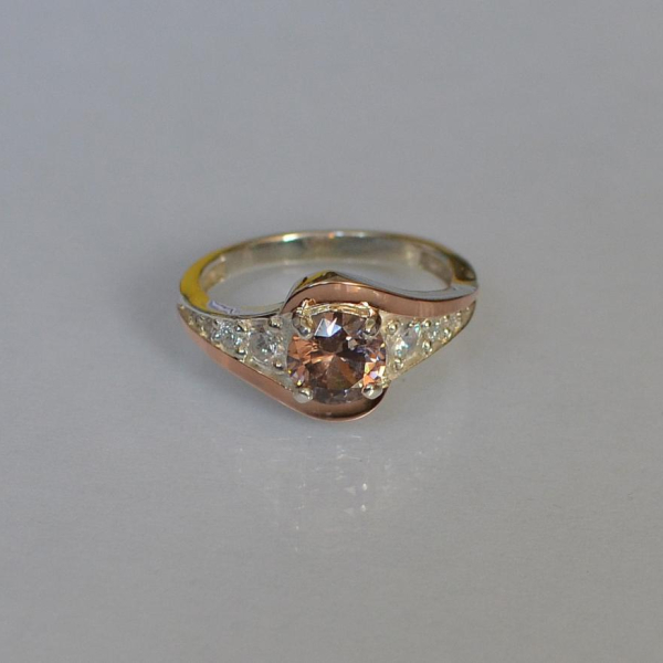 Срібна каблучка з золотими вставками