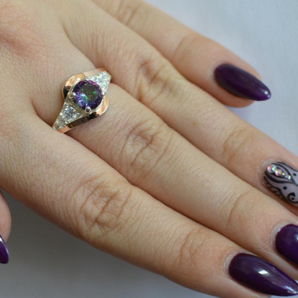 Срібна каблучка з золотими вставками