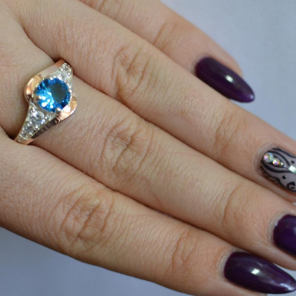 Срібна каблучка з золотими вставками