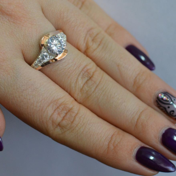 Срібна каблучка з золотими вставками