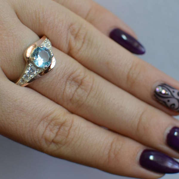 Срібна каблучка з золотими вставками