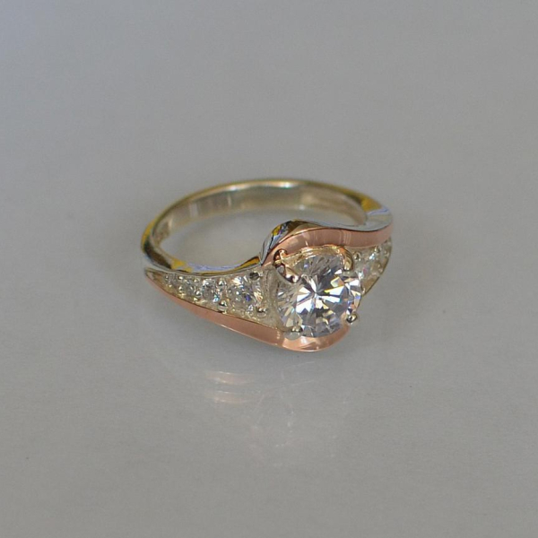 Срібна каблучка з золотими вставками