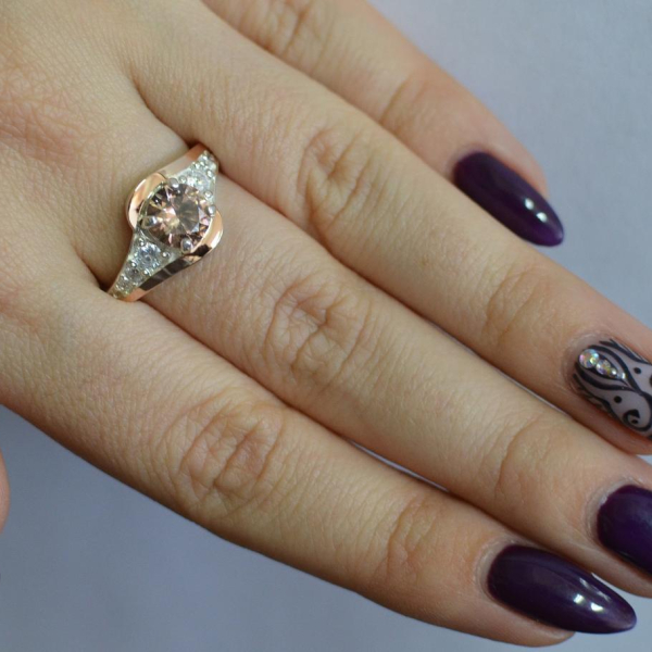 Срібна каблучка з золотими вставками