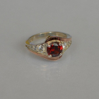 Срібна каблучка з золотими вставками