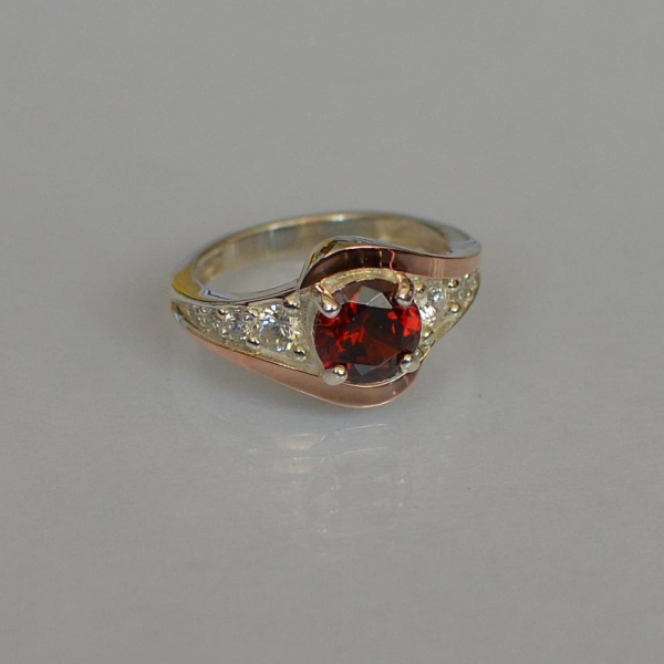 Срібна каблучка з золотими вставками