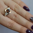 Срібна каблучка з золотими вставками