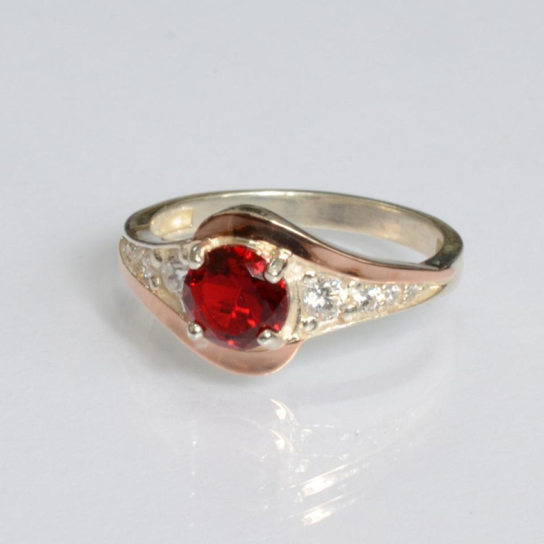 Срібна каблучка з золотими вставками