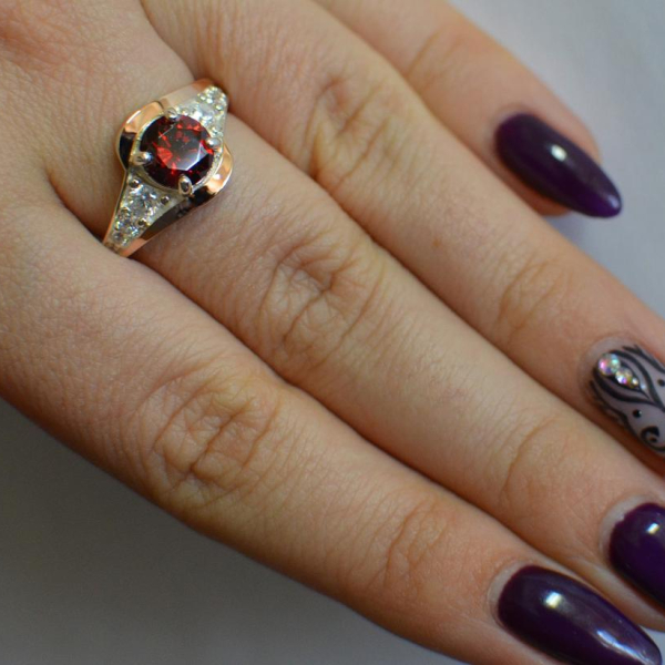 Срібна каблучка з золотими вставками