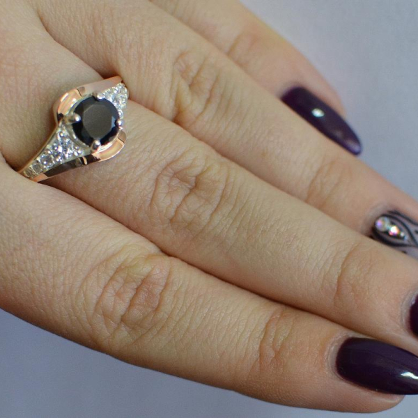 Срібна каблучка з золотими вставками