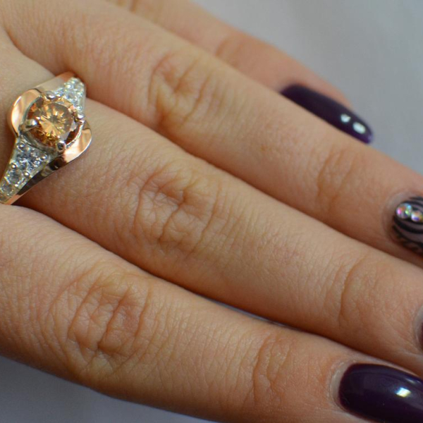 Срібна каблучка з золотими вставками