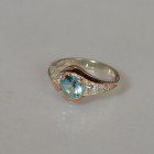 Срібна каблучка з золотими вставками