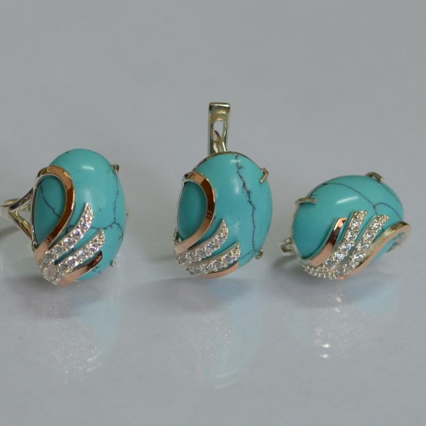 Срібний набір з золотими пластинами