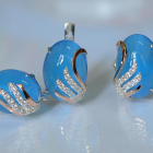 Срібний набір з золотими пластинами