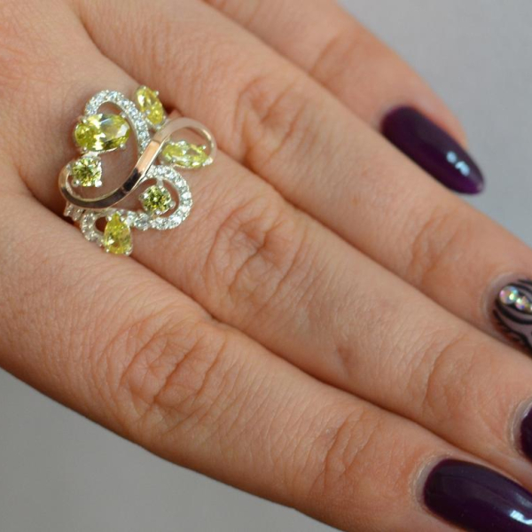 Срібна каблучка з золотими вставками