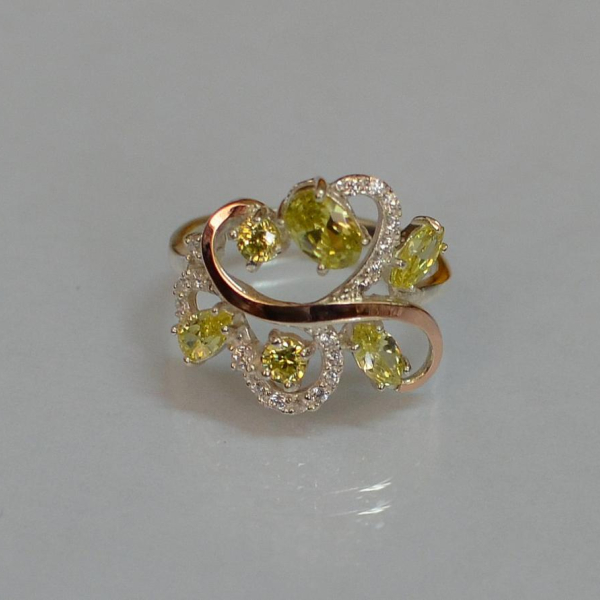 Срібна каблучка з золотими вставками