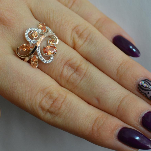 Срібна каблучка з золотими вставками