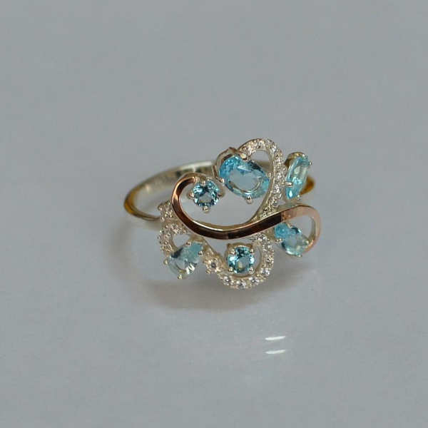 Срібна каблучка з золотими вставками