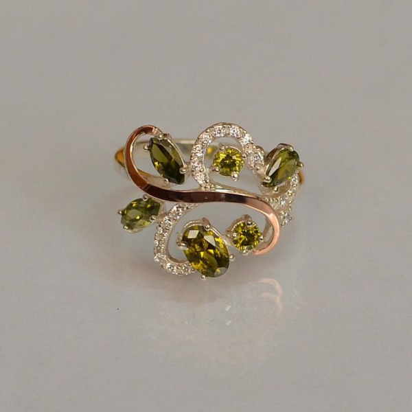 Срібна каблучка з золотими вставками