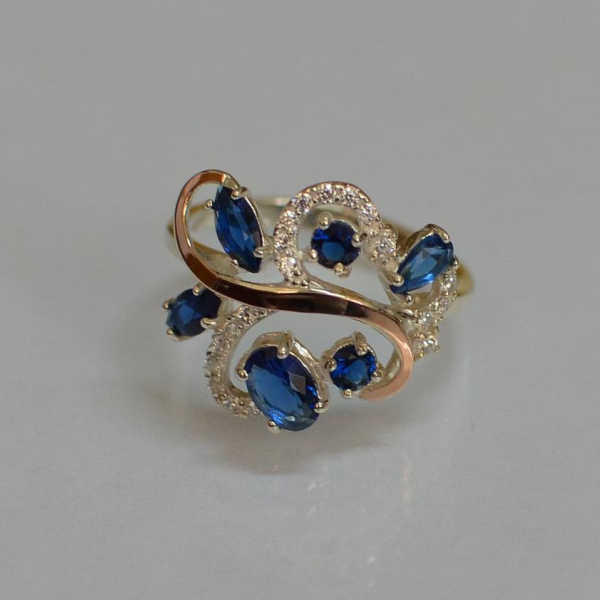 Срібна каблучка з золотими вставками