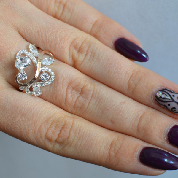 Срібна каблучка з золотими вставками