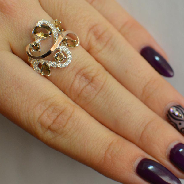 Срібна каблучка з золотими вставками