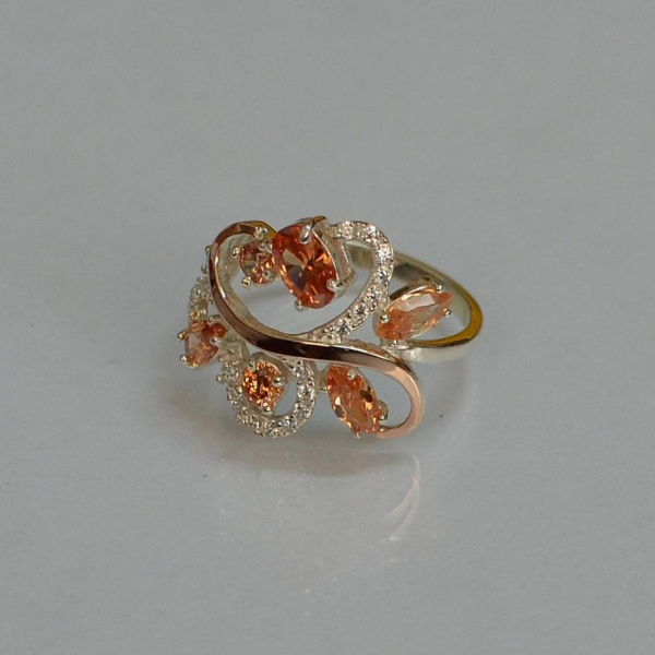 Срібна каблучка з золотими вставками