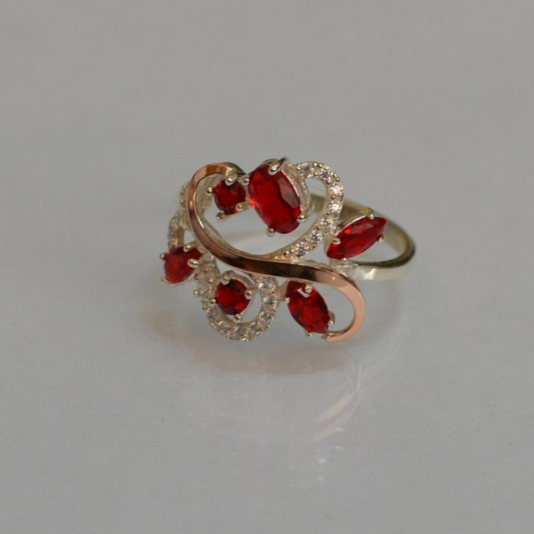 Срібна каблучка з золотими вставками