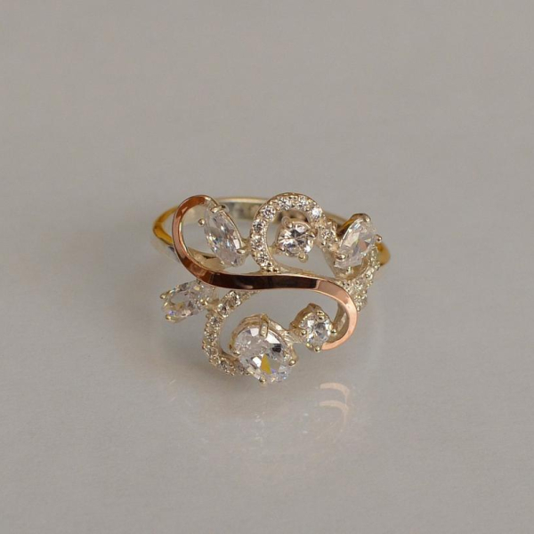 Срібна каблучка з золотими вставками