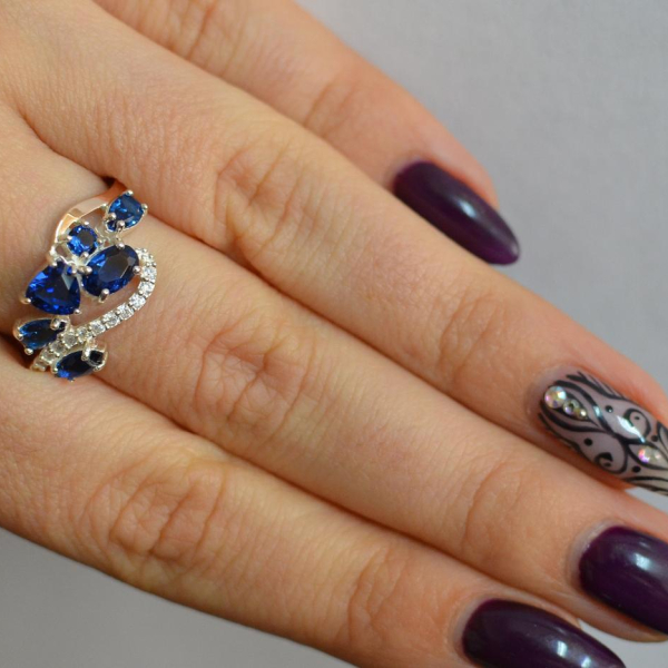 Срібна каблучка з золотими вставками