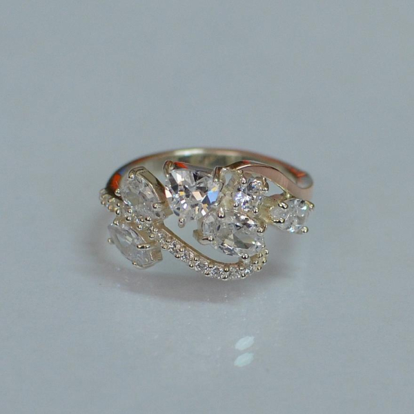 Срібна каблучка з золотими вставками