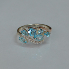 Срібна каблучка з золотими вставками