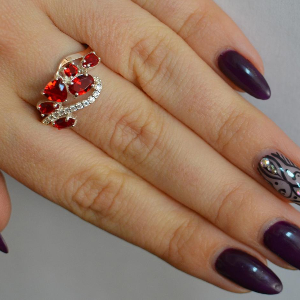 Срібна каблучка з золотими вставками