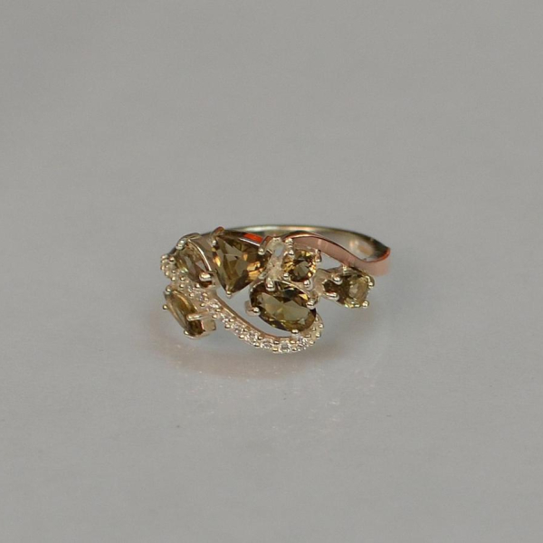 Срібна каблучка з золотими вставками