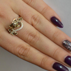 Срібна каблучка з золотими вставками