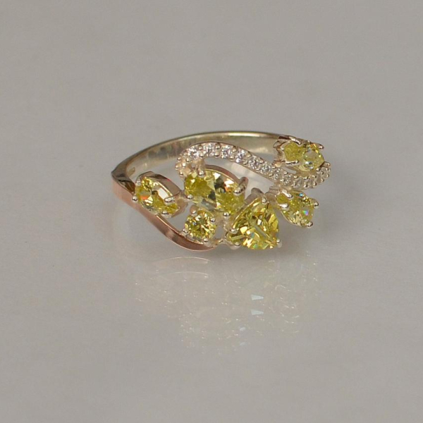 Срібна каблучка з золотими вставками