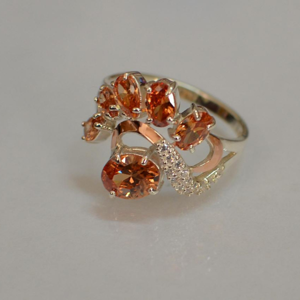 Срібна каблучка з золотими вставками