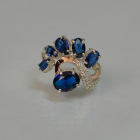 Срібна каблучка з золотими вставками