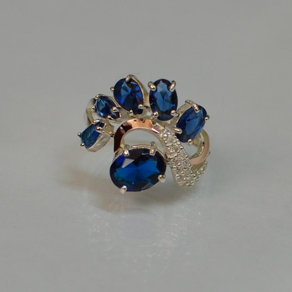 Срібна каблучка з золотими вставками