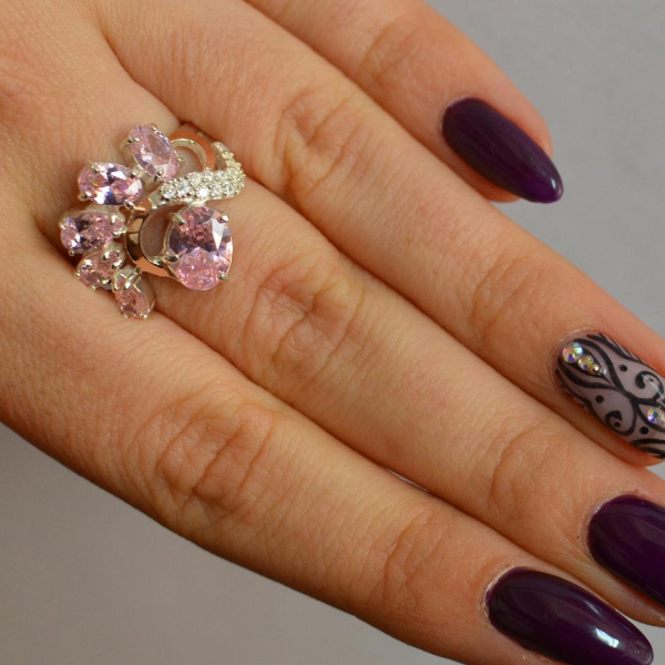 Срібна каблучка з золотими вставками