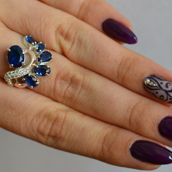 Срібна каблучка з золотими вставками